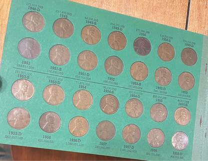 Collector's lot of penny books featuring Lincoln and Indian Head pennies, includes near-mint steel cents bonus.