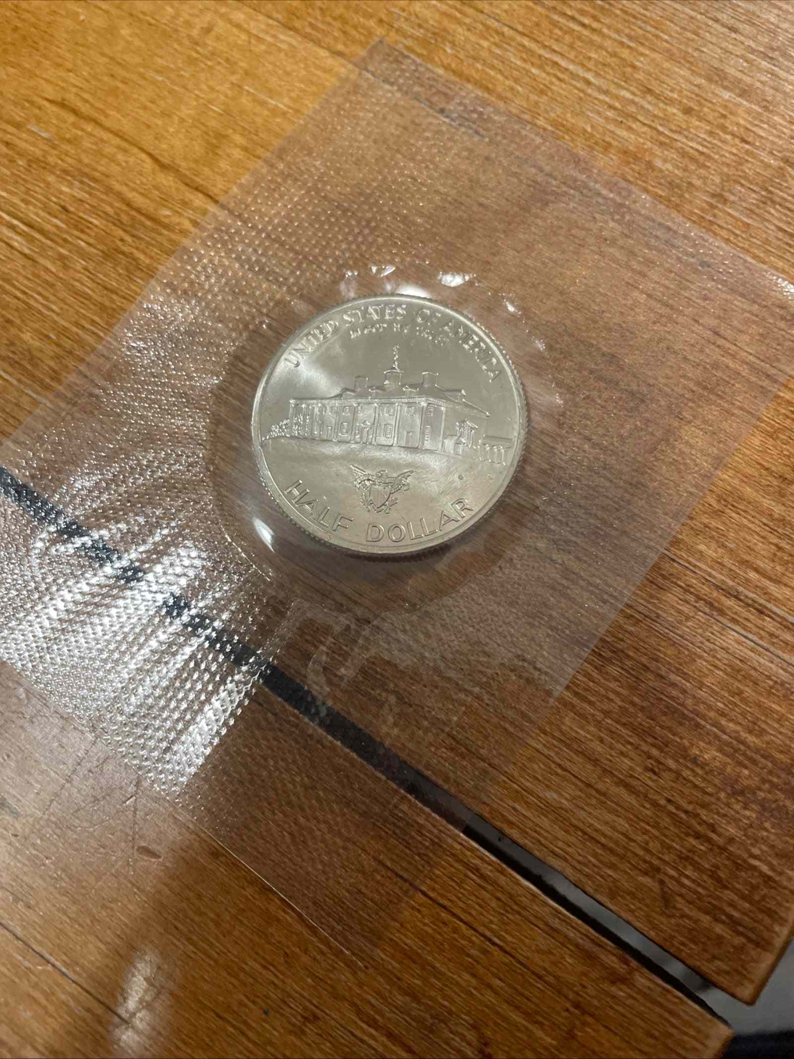 1982 George Washington 250th Anniversary silver half dollar coin in protective packaging.