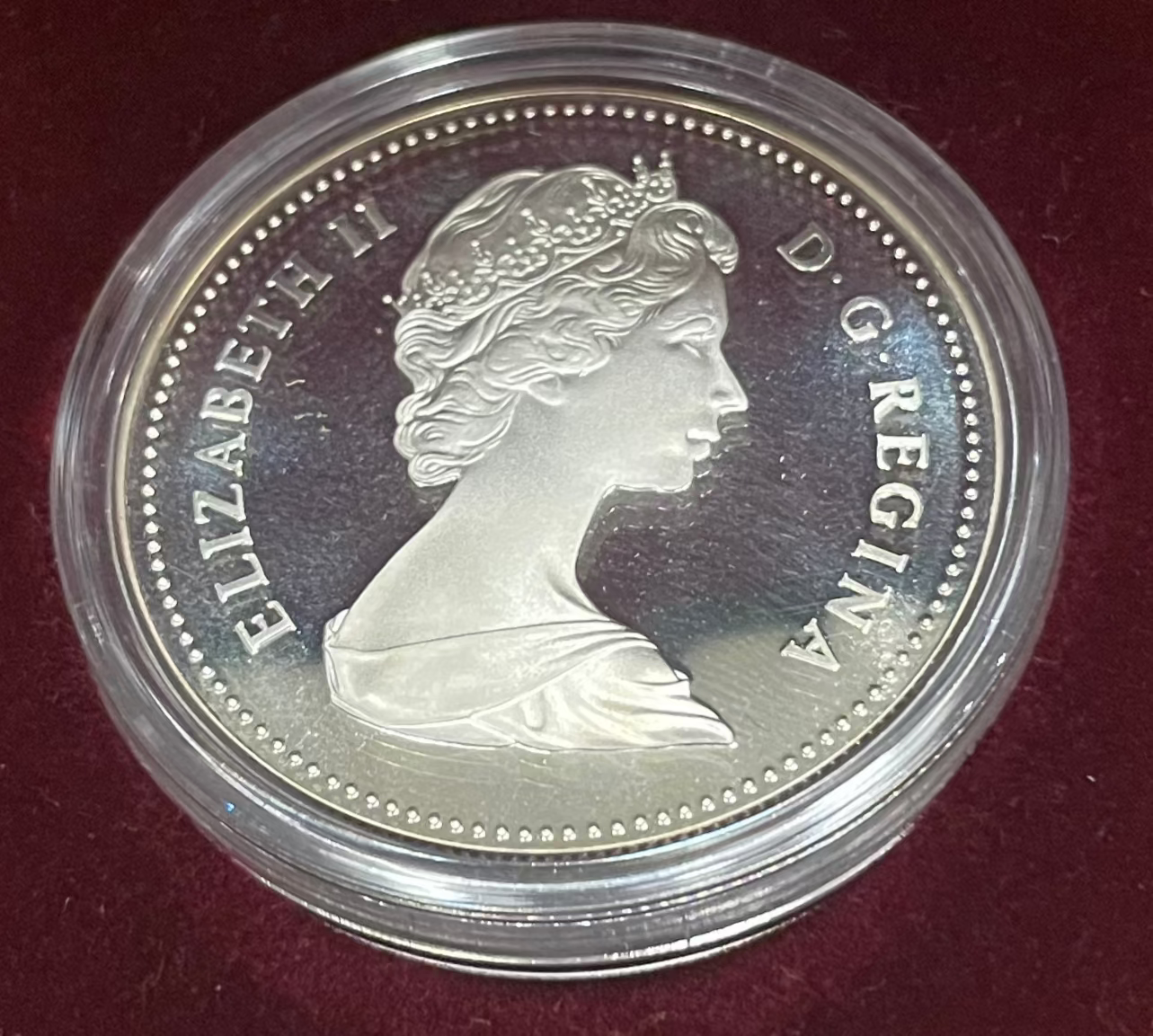 1982 Canada Silver Dollar Regina Centennial coin in a protective case.