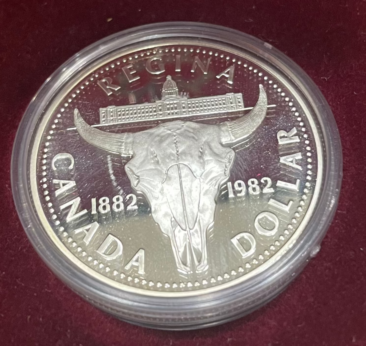 1982 Canada Silver Dollar Regina Centennial coin featuring elegant design.