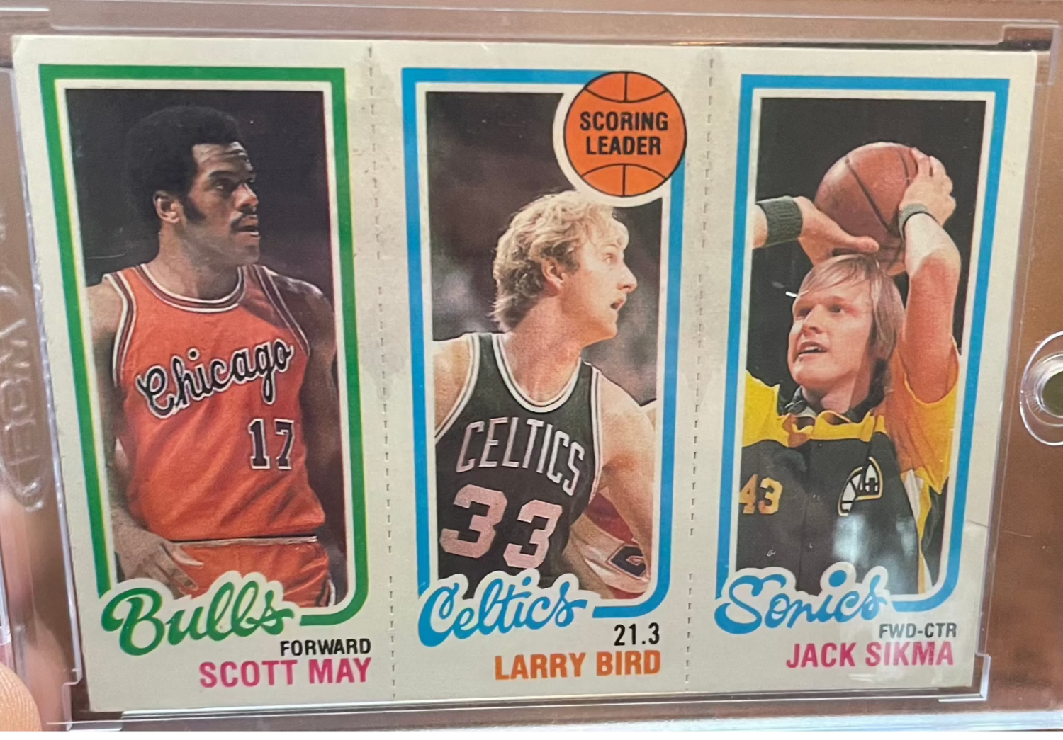 1980-81 Topps basketball rookie card featuring Larry Bird, Jack Sikma, and Scott May.
