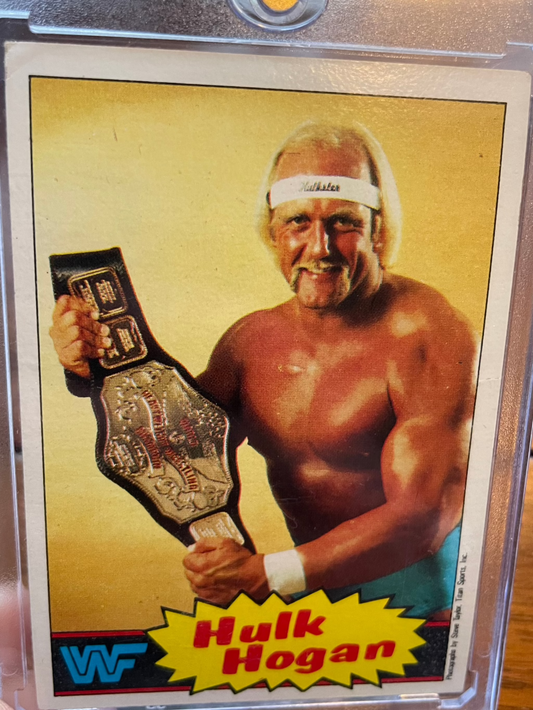 1985 Topps WWF RC Rookie #1 Hulk Hogan card featuring iconic wrestler with championship belt.