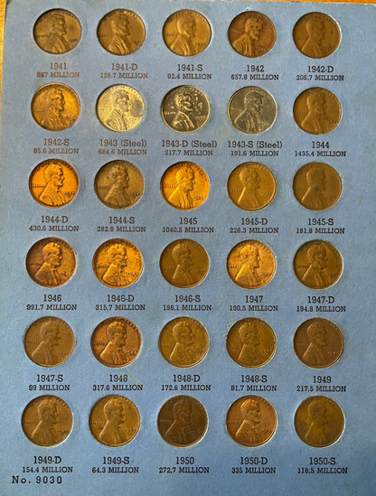 Collector's lot of penny books featuring Lincoln cents, Indian Head pennies, and near-mint 1943 steel cents.