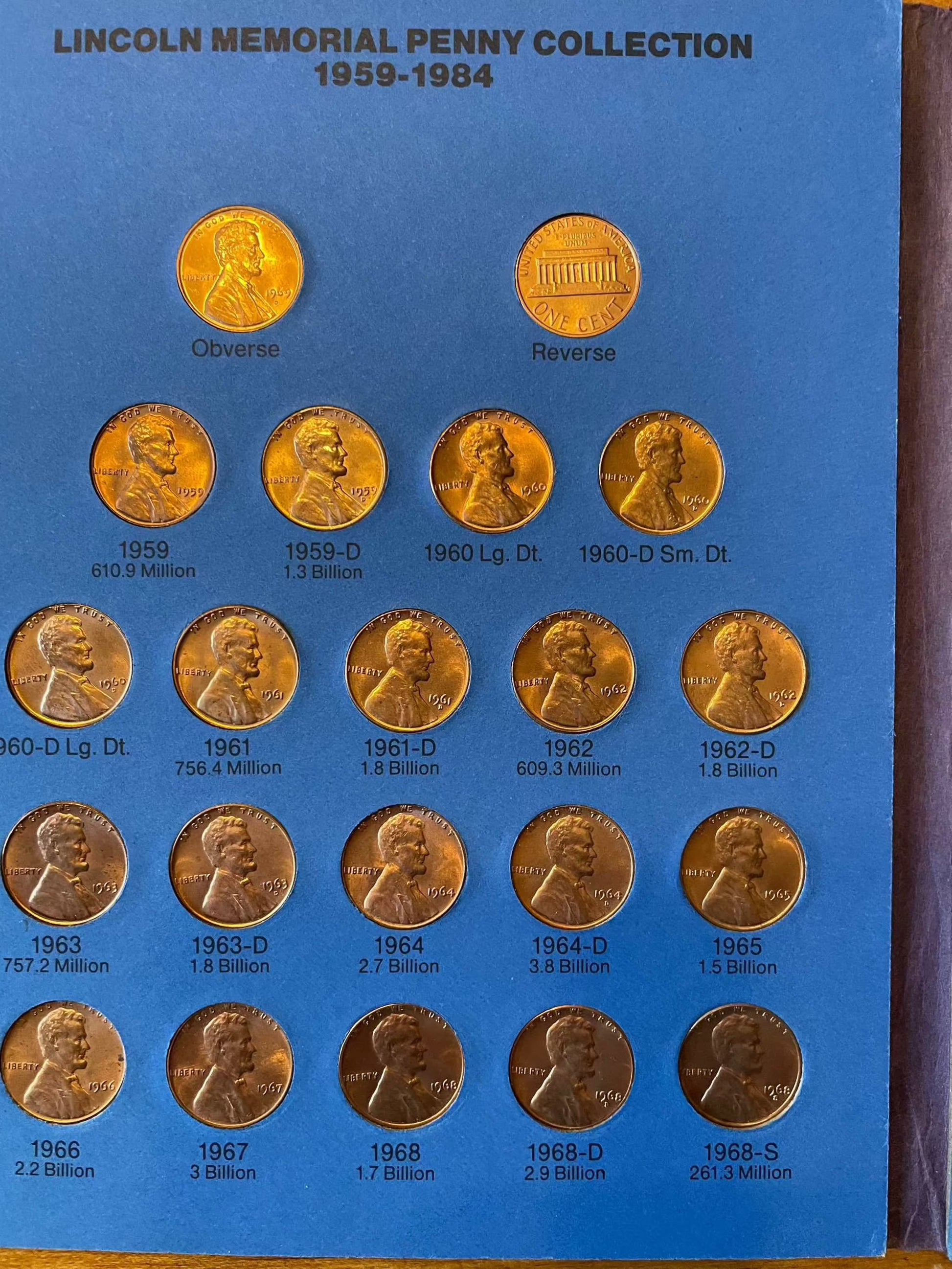 Collector's lot of penny books with near-mint steel cents bonus, featuring Lincoln and Indian Head pennies.