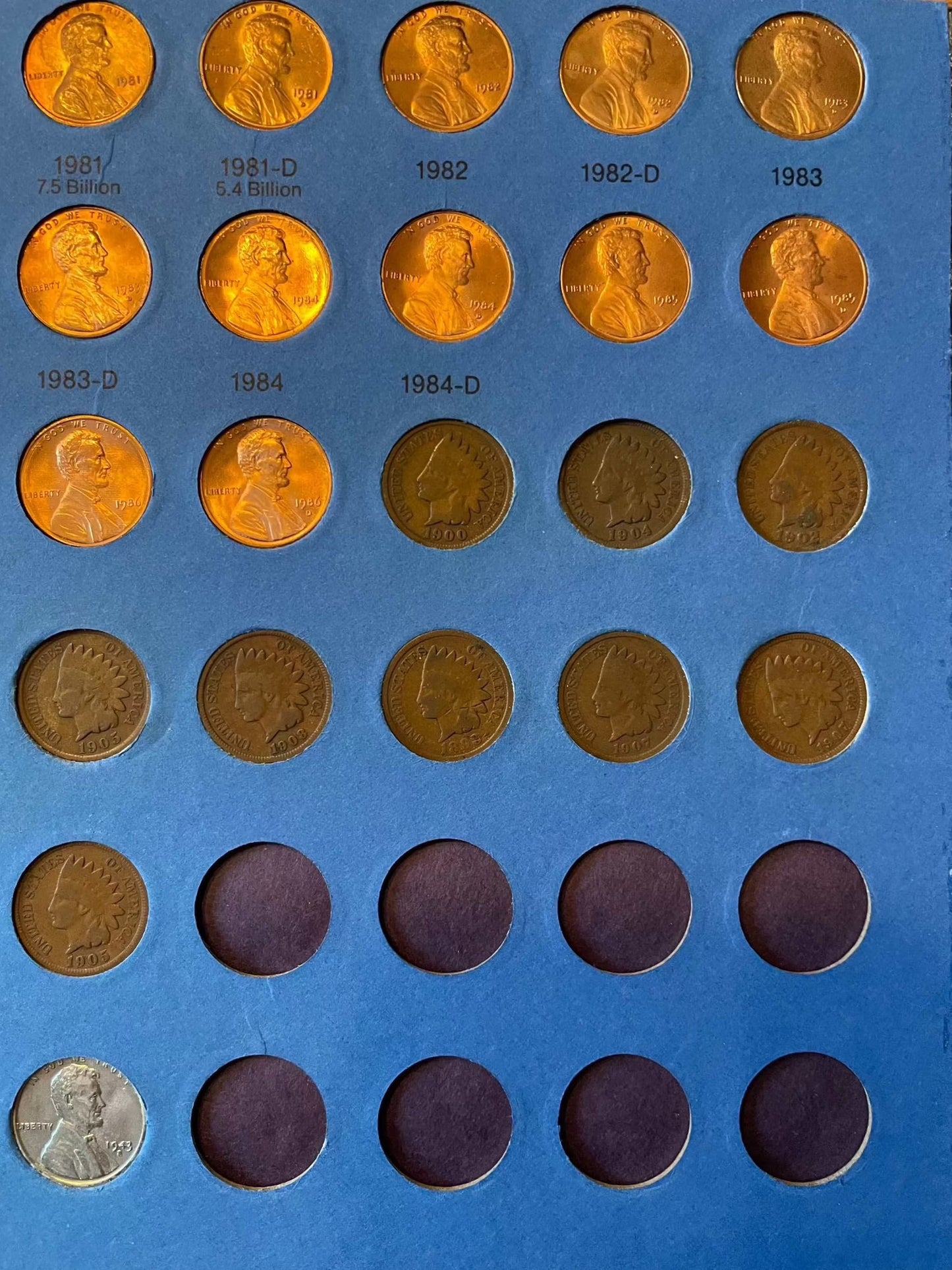 Collector's penny book with Lincoln cents, including near-mint steel cents and Indian Head penny bonuses.