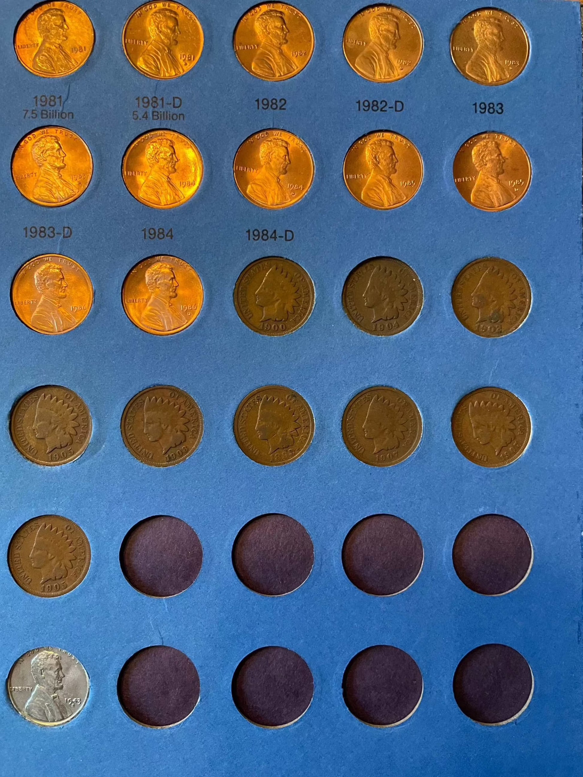 Collector's penny book with Lincoln cents, including near-mint steel cents and Indian Head penny bonuses.