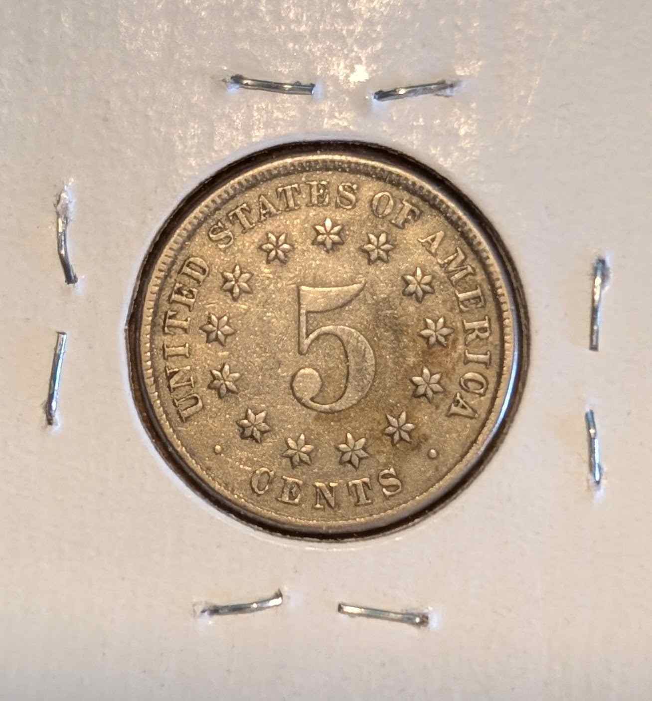 1882 Shield Nickel EF40 condition with intricate shield design.