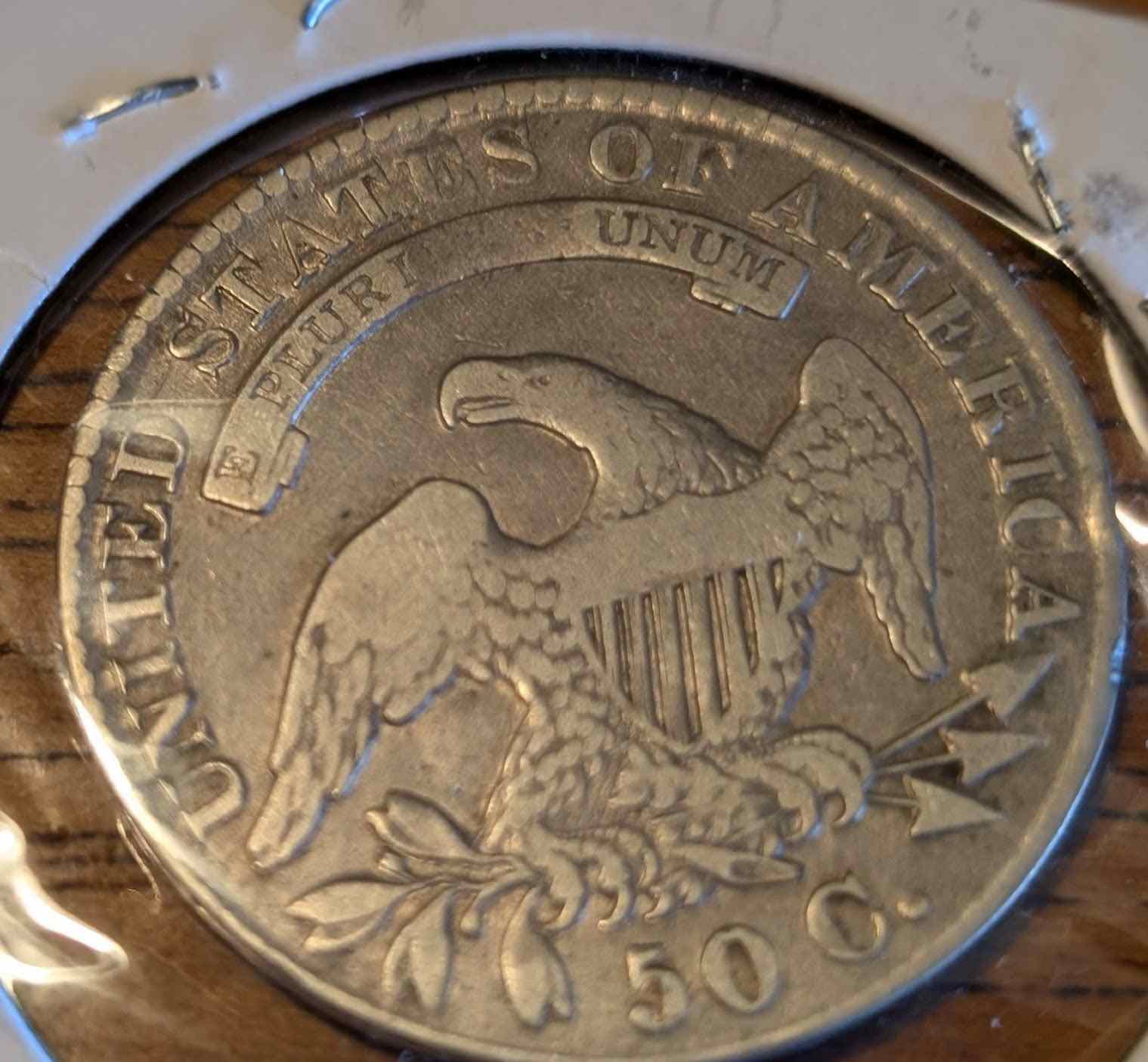 1830 Capped Bust Half (small O) coin featuring intricate design.