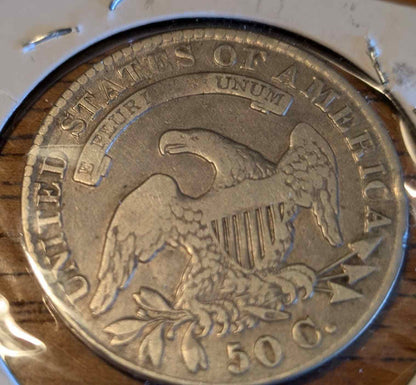 1830 Capped Bust Half (small O) coin featuring intricate design.