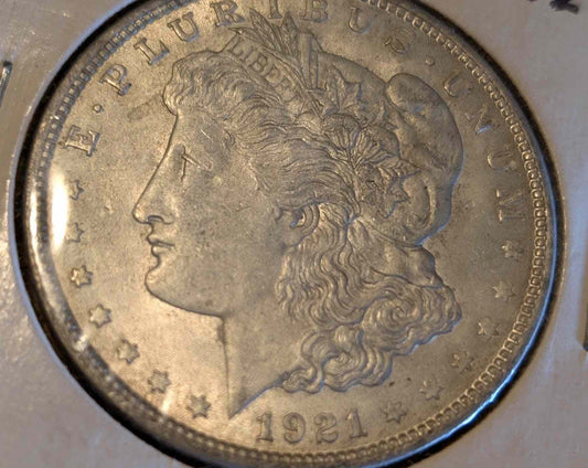 1921 Morgan Silver Dollar in excellent condition displaying intricate design.
