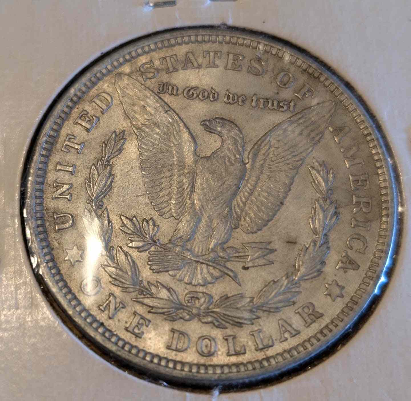 1921 Morgan Silver Dollar coin with eagle design in excellent condition.