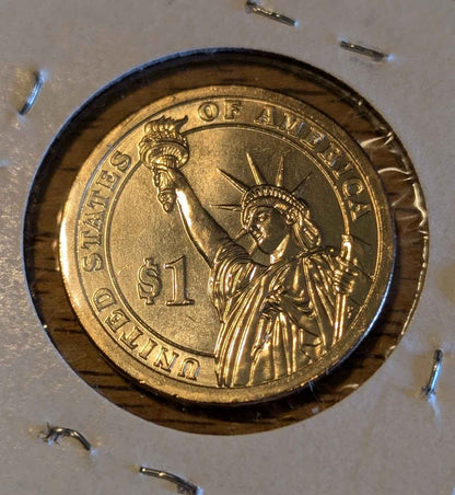 2011 Rutherford B. Hayes Presidential Dollar coin with intricate design.