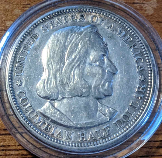 1892 Columbian Half Dollar commemorative coin celebrating Columbus's voyage.