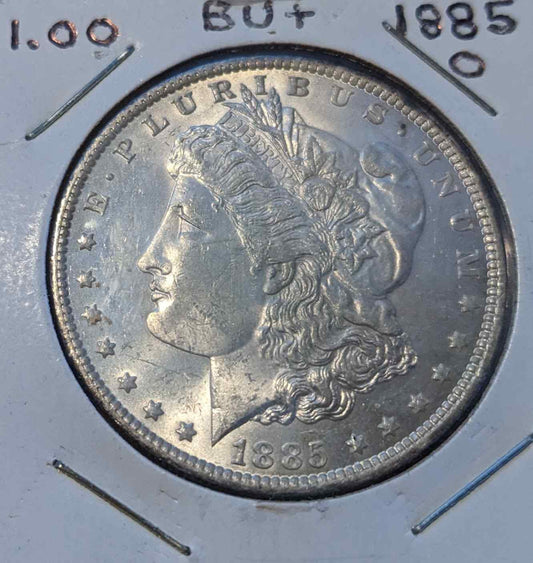 1885 O Morgan Silver Dollar in brilliant uncirculated condition showcasing exquisite details.