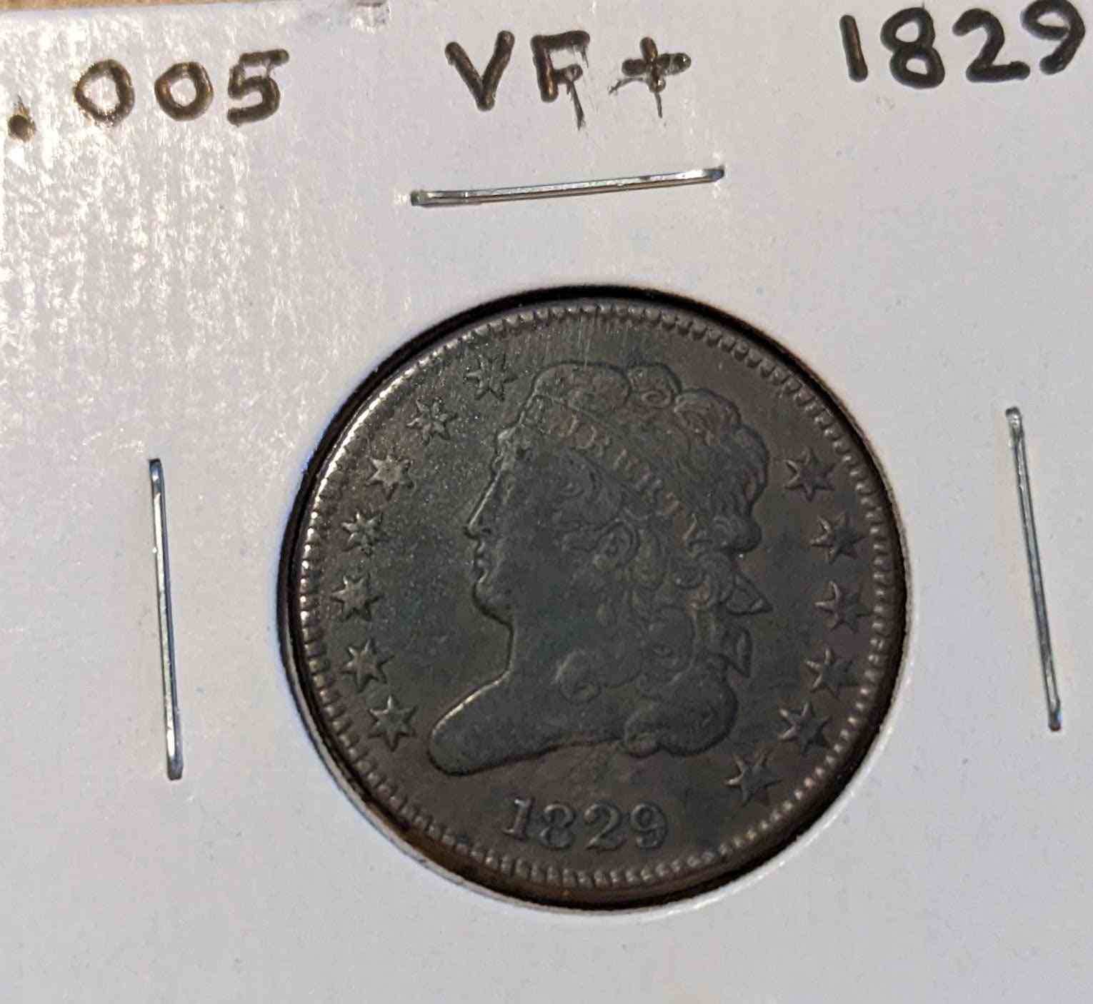 1829 Classic Head Half Cent coin with elegant design displayed in protective holder.