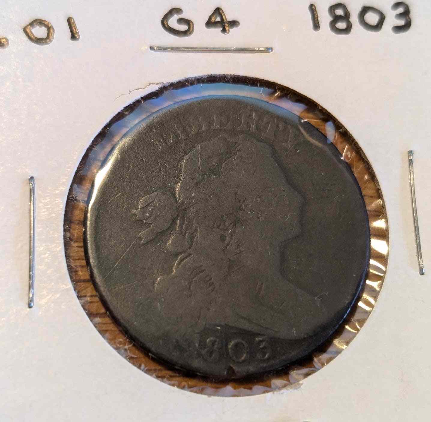 1803 Draped Bust Large Cent coin with small date and large fraction, G4 graded.