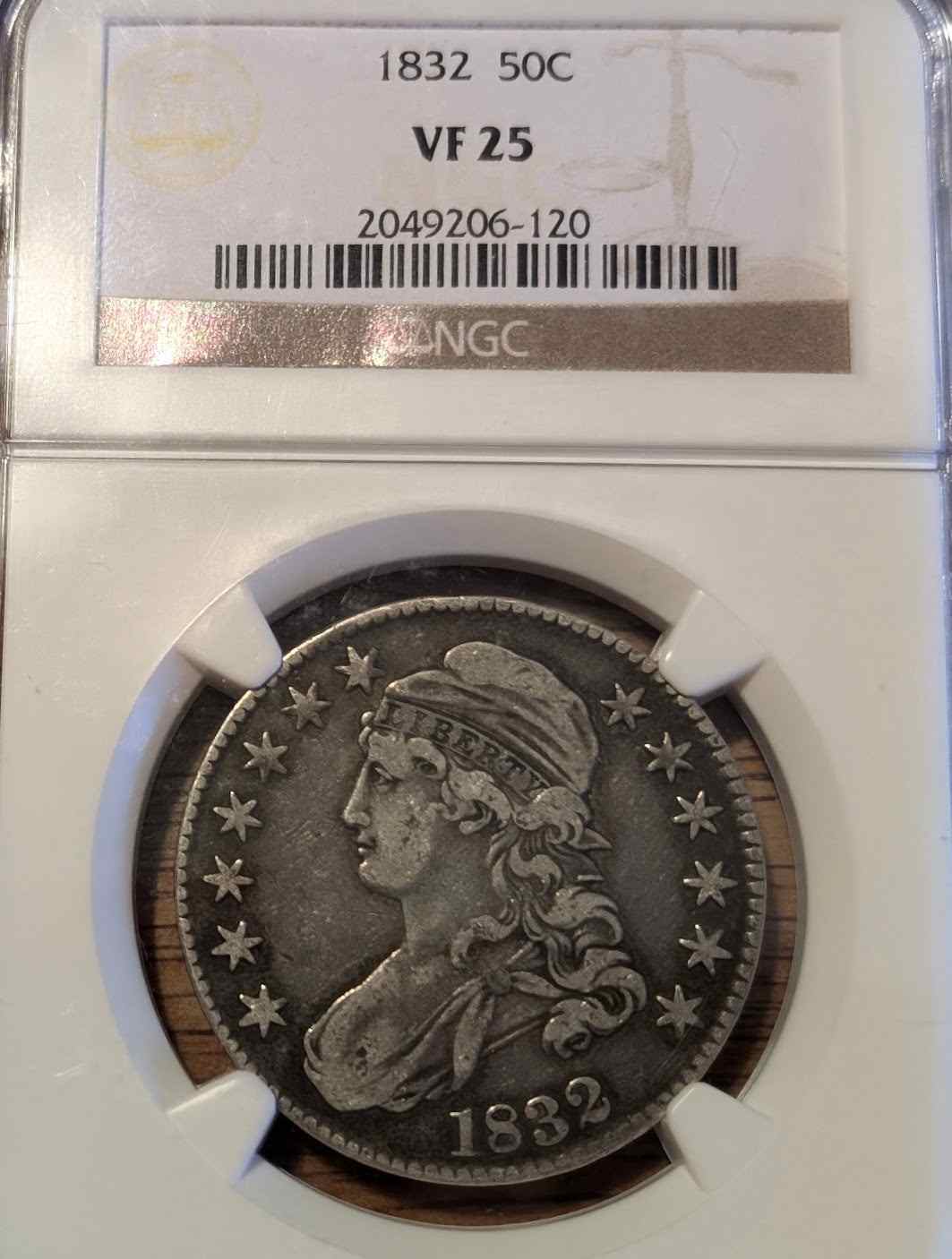1832 Capped Bust Half coin VF25 with intricate designs.