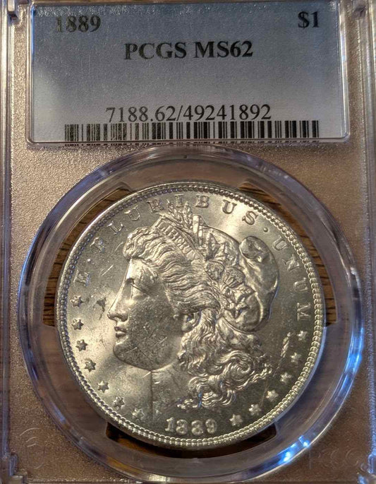 1889 Morgan Silver Dollar MS62 graded coin in protective case.