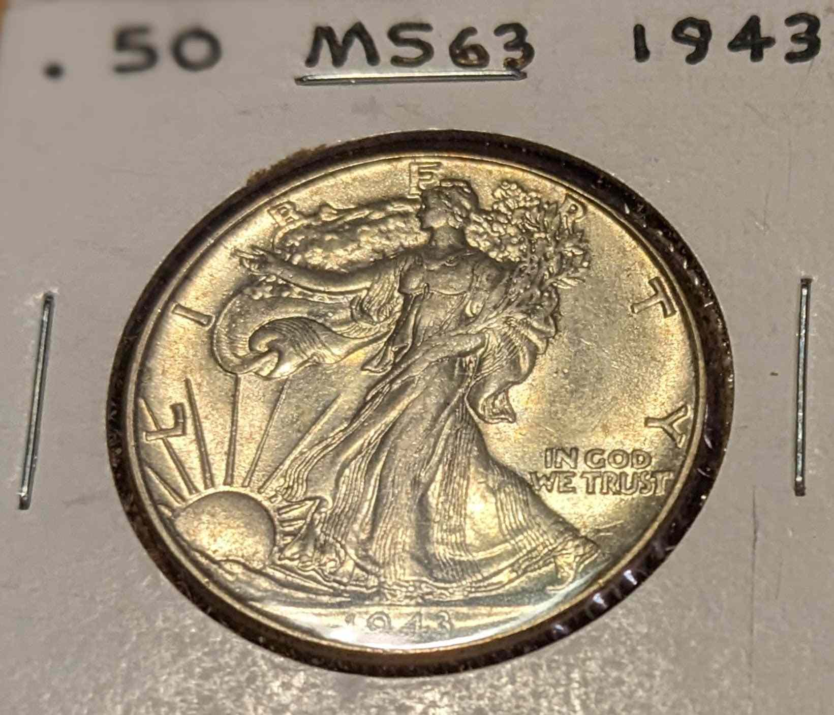 1943 Walking Liberty Half coin, 90% silver, Lady Liberty with olive and oak branches.