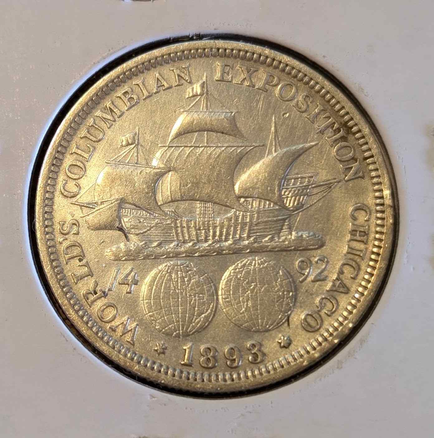1893 Columbian Half commemorative coin with ship engraving celebrating Columbus's voyage, perfect for collectors.