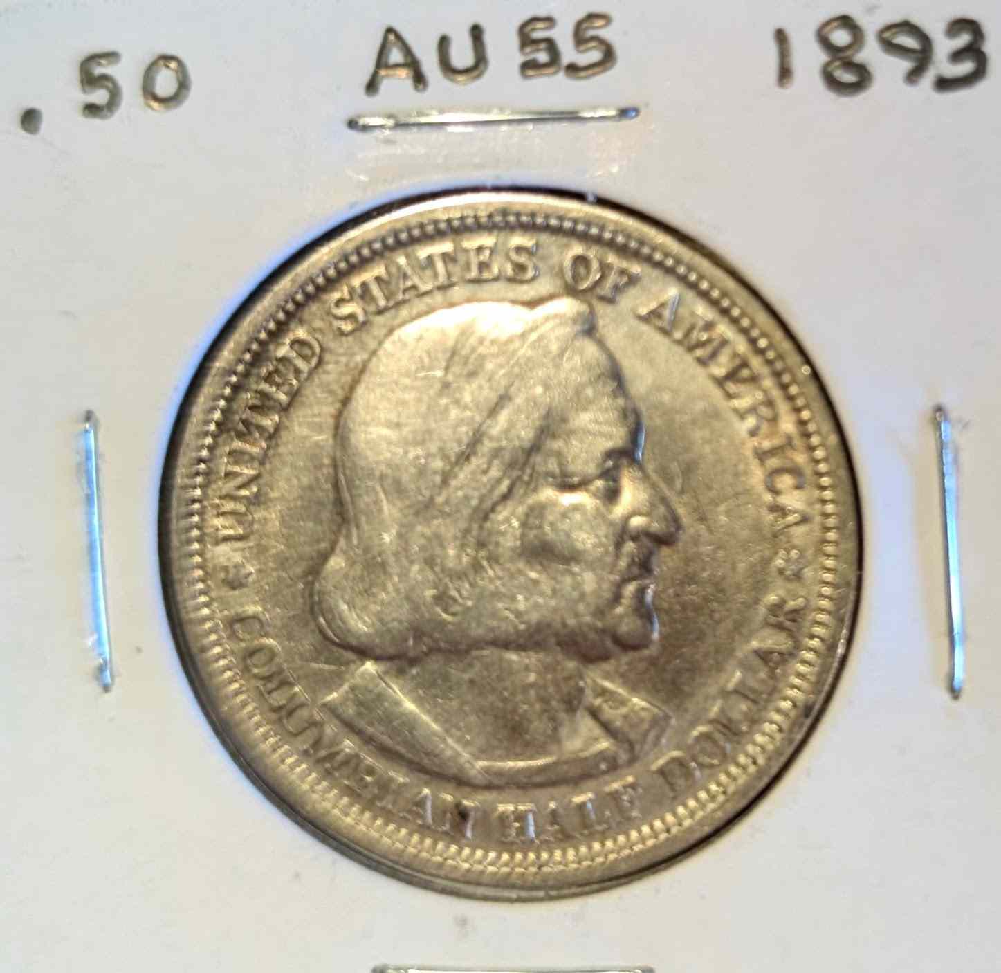 1893 Columbian Half Dollar coin, almost uncirculated condition, featuring historical detail.