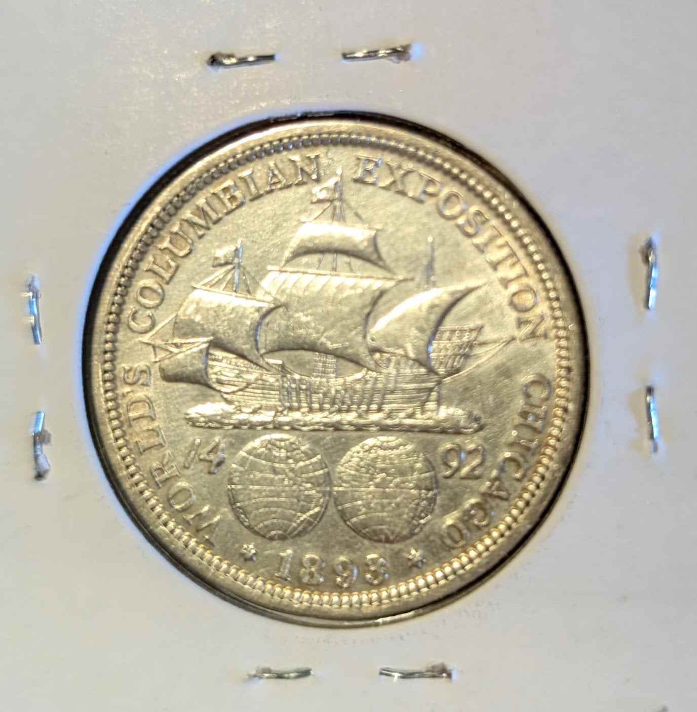 1893 Columbian Half Dollar coin in almost uncirculated quality featuring detailed design.
