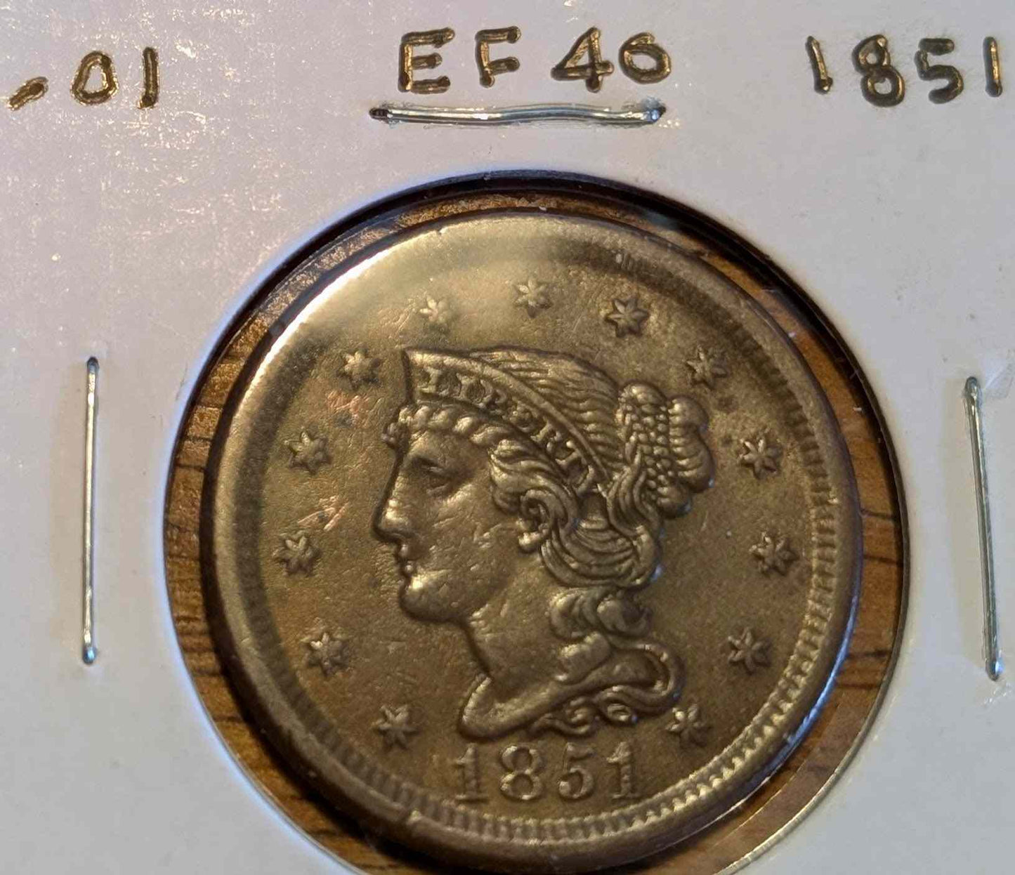 1851 Braided Hair Large Cent in extremely fine condition showcasing intricate braids and historical detail.