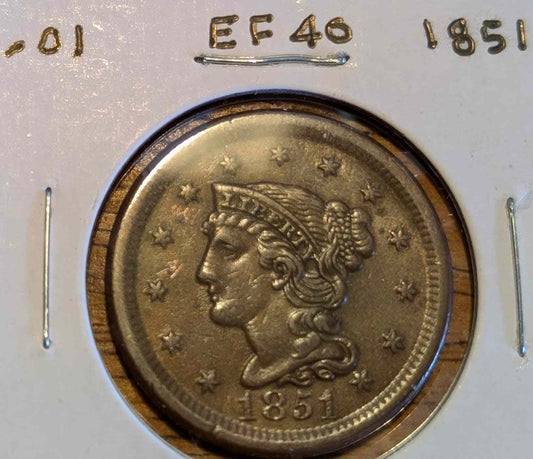 1851 Braided Hair Large Cent in extremely fine condition showcasing intricate braids and historical detail.