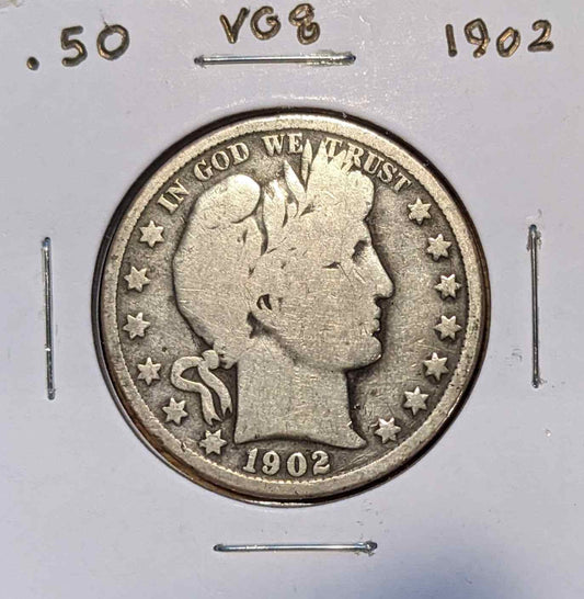 1902 Barber Half Dollar coin with intricate design, 90% silver composition.