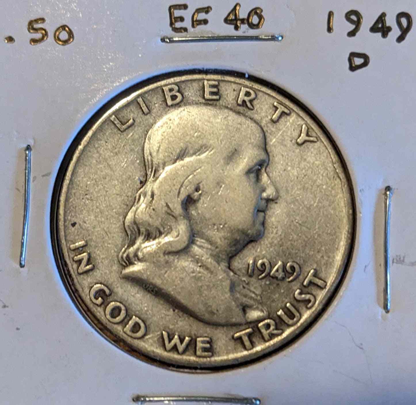 1949 D Franklin Half Dollar coin featuring Benjamin Franklin and Liberty Bell.