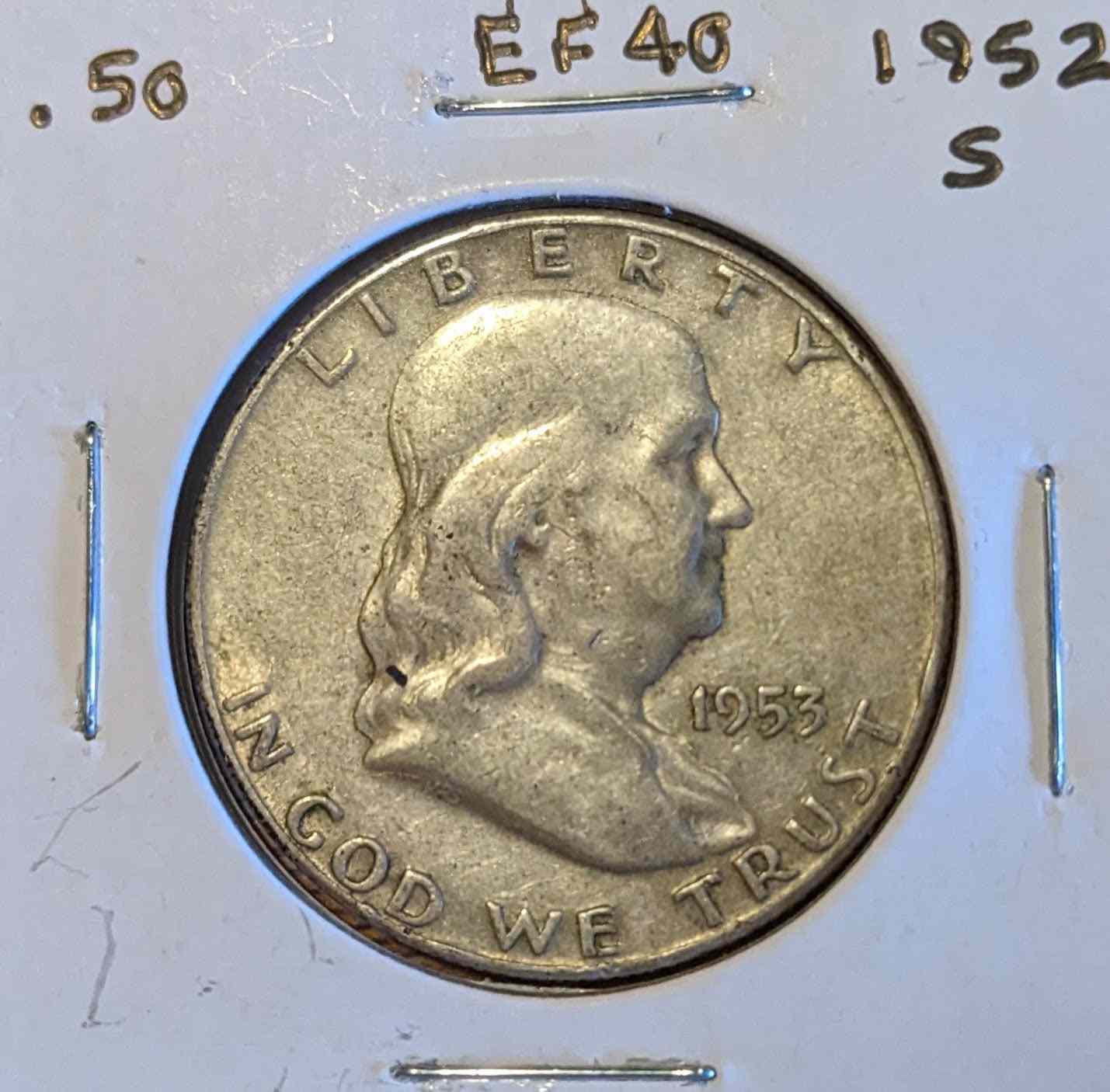 Franklin Half Dollar coin with bust of Benjamin Franklin, obverse view, labeled EF40.