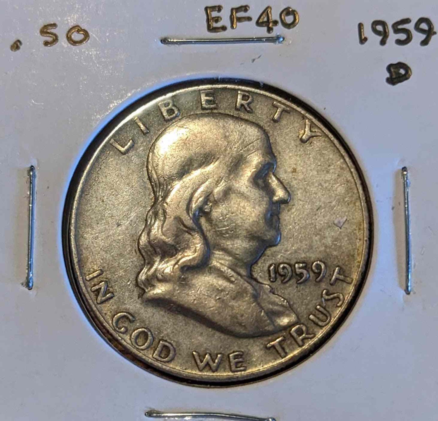 Franklin Half Dollar 1959-D coin featuring Benjamin Franklin and Liberty Bell.