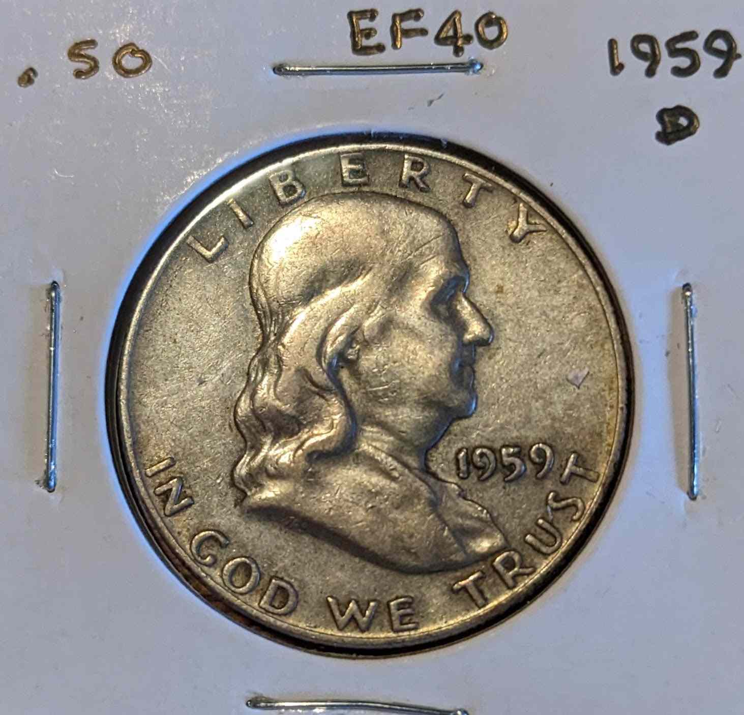 Franklin Half Dollar 1959-D coin featuring Benjamin Franklin and Liberty Bell.