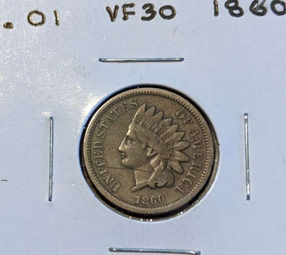 1860 Indian Head Cent coin featuring Lady Liberty with Native American headdress.