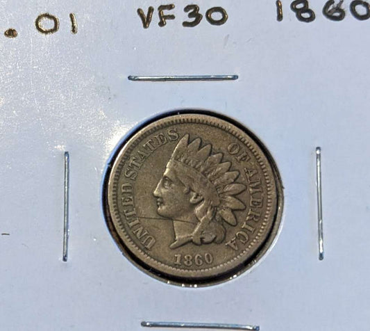 1860 Indian Head Cent coin featuring Lady Liberty with Native American headdress.