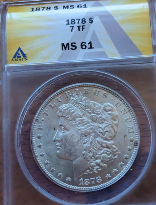 1878 Morgan Silver Dollar MS61 with 7 tail feathers in protective case.