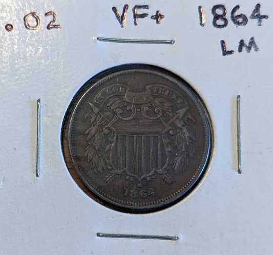 1864 Two-Cent Piece coin with large motto displayed in a collector's holder.