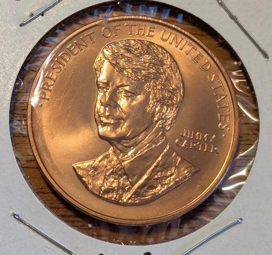 1977 President Jimmy Carter Bronze Medal from US Mint featuring presidential portrait and inscription.
