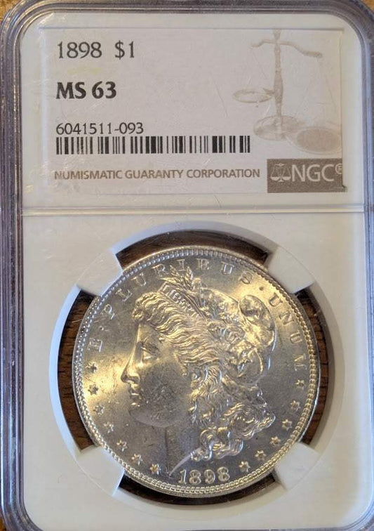 1898 Morgan Silver Dollar MS63 in protective case, showcasing its detailed design and excellent condition.