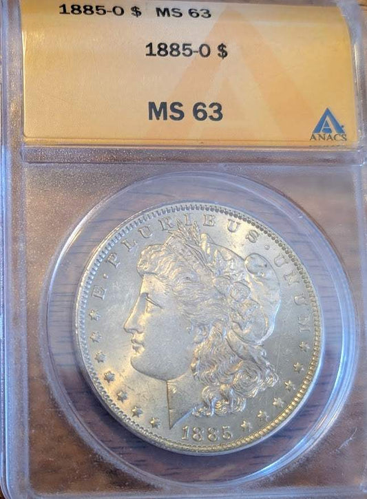 1885 O Morgan Silver Dollar in protective case with MS 63 grade.