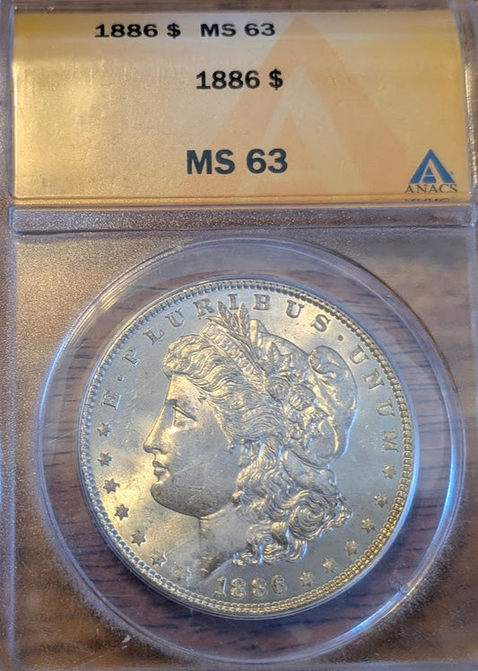 1886 Morgan Silver Dollar graded MS63 in protective case.