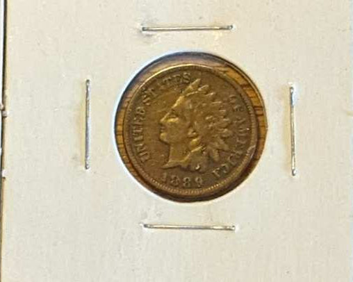 Lot of four Indian Head Cents from 1894, 1889, 1905, and 1907 showcasing iconic design.