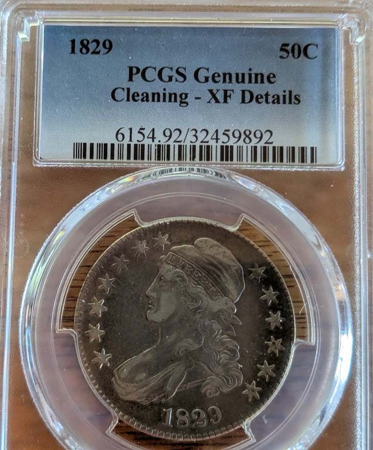 1829 Morgan Silver Dollar with Lady Liberty and eagle design, fine quality coin in protective case.