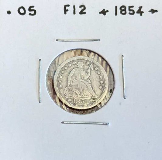 1854 Seated Liberty Half Dime with Arrows, rare collectible coin.