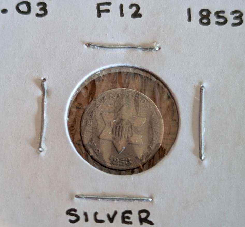 1853 silver three-cent piece in fine condition, valuable historical coin for collectors.