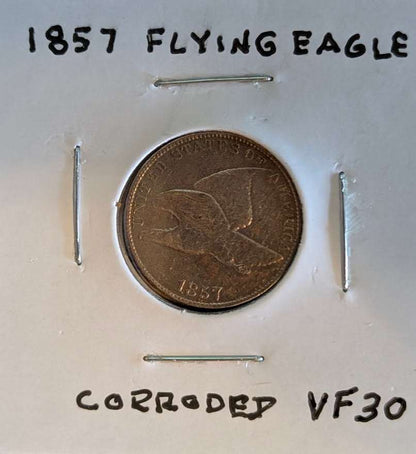 1857 Flying Eagle Cent in corroded VF30 condition, showcasing historic American coinage design.