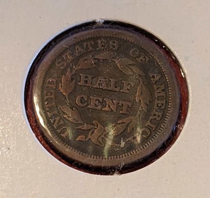 1853 Braided Hair Half Cent coin showing wreath and United States of America inscription