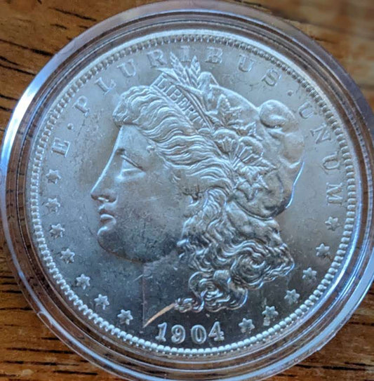 1904-O Morgan Silver Dollar from New Orleans Mint in MS62 condition with strong luster and silver content