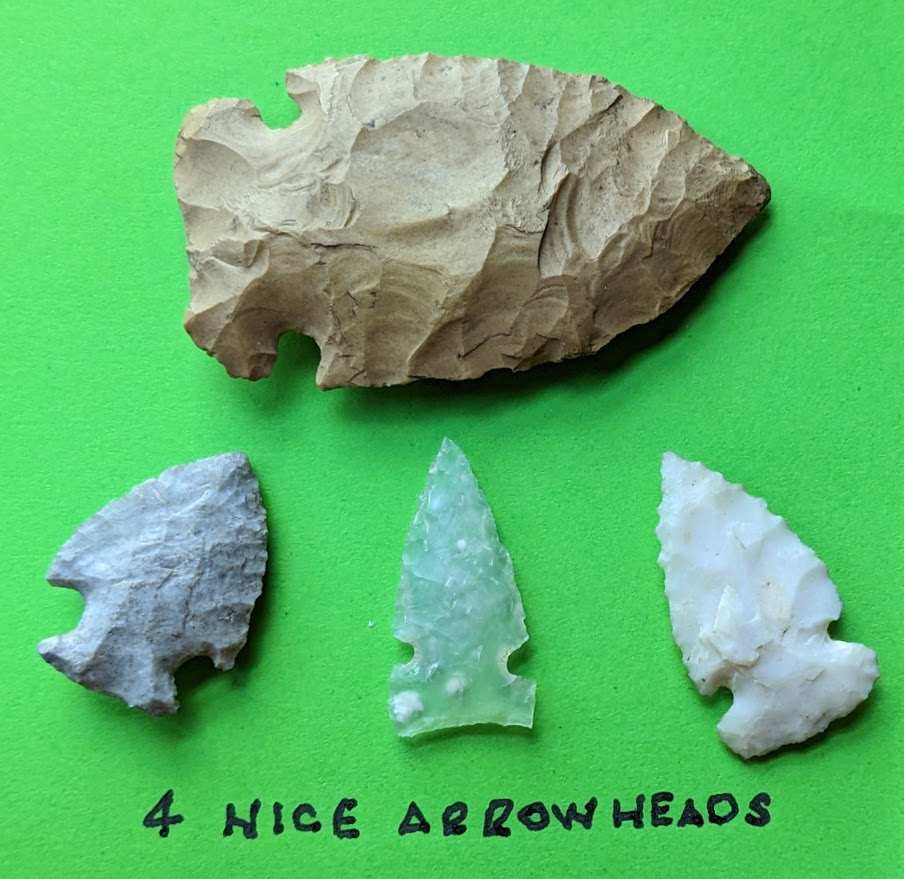 Lot of 4 authentic Native American arrowheads in mixed flint and quartz materials including a translucent green point