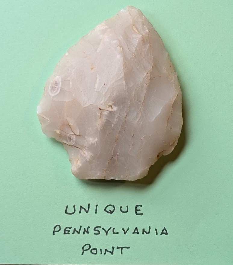 Semi-translucent Pennsylvania quartz/chert arrowhead with flaked edges and primitive shaping